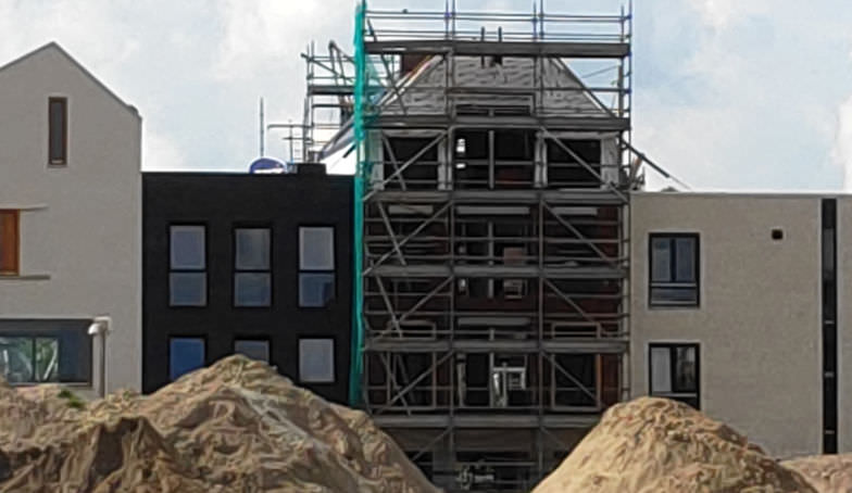 Nieuwe en oude foto's van de bouw van het Statenpand E1 op de Melkhal Enschede!